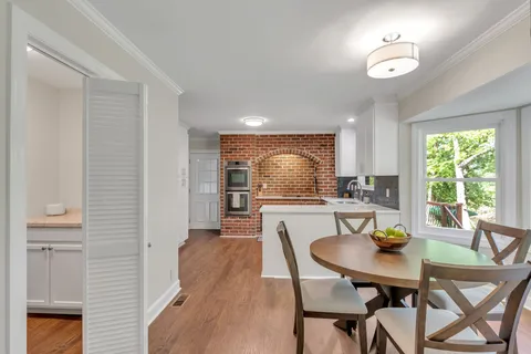 a view of a dining room with furniture window and outside view