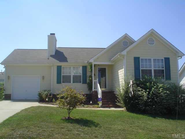4412 Moss Spring Drive Raleigh, NC 27616 - Photo 1 of 1 a front view of a house with a yard