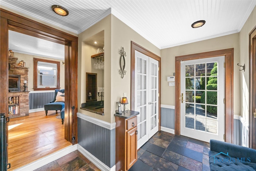 1951 Richmond Road Toledo, OH 43607 - Photo 13 of 45 French door entry from the backyard into the rear mudroom with tile flooring also features a large pantry behind the pair of French doors as well as a wet bar