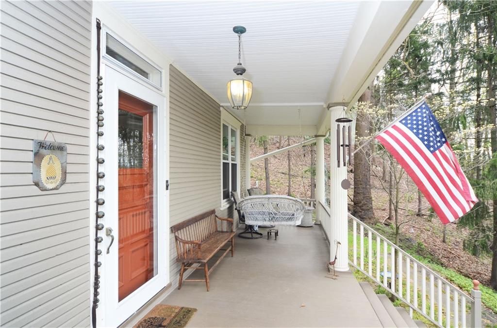 520 Sycamore Road Sewickley, PA 15143 - Photo 3 of 24 Beautiful wood front door with newer storm door. Great spot to read a book or to just enjoy the views. Home is 1,876 sq. ft. per Allegheny County.