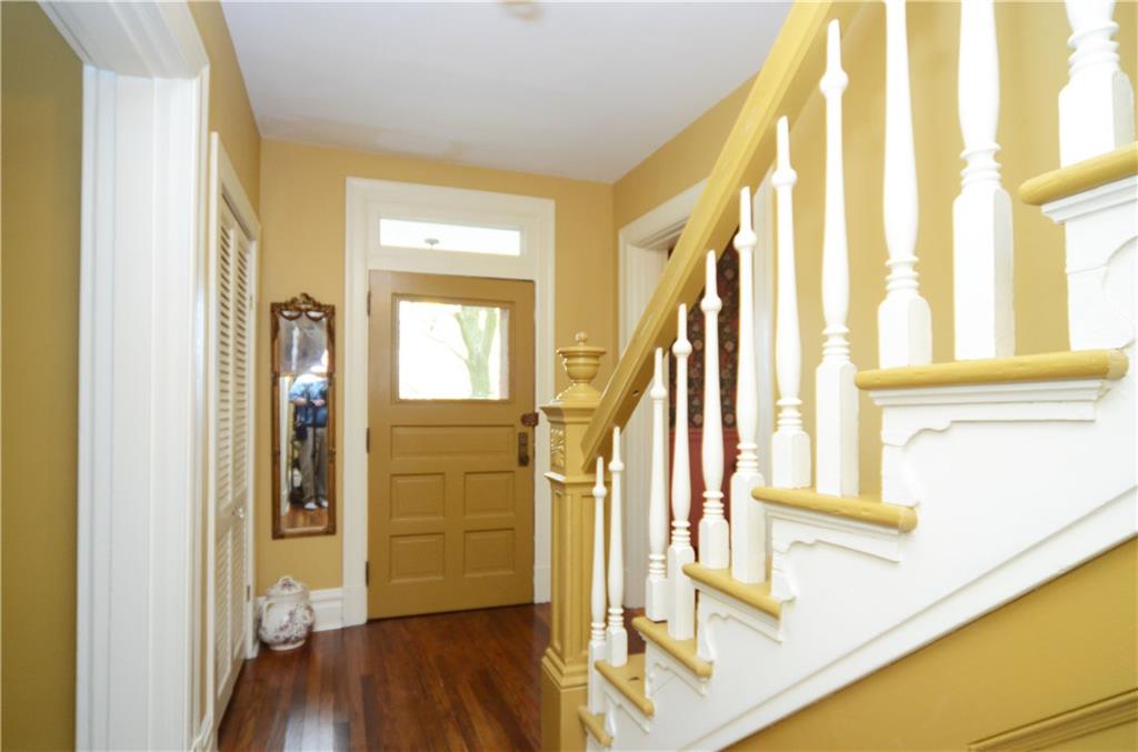 520 Sycamore Road Sewickley, PA 15143 - Photo 6 of 24 Main level hallway with coat closet, hardwood flooring.