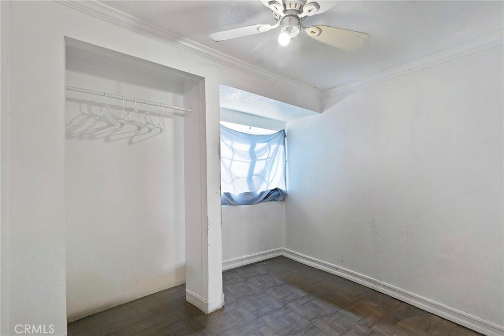 5729 Juarez Avenue Whittier, CA 90606 - Photo 20 of 42 an empty room with windows and fan