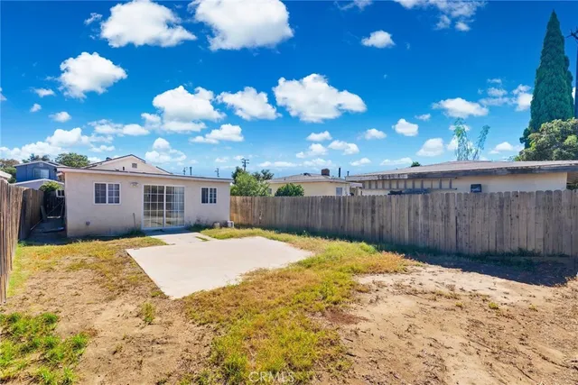 a view of a backyard of the house