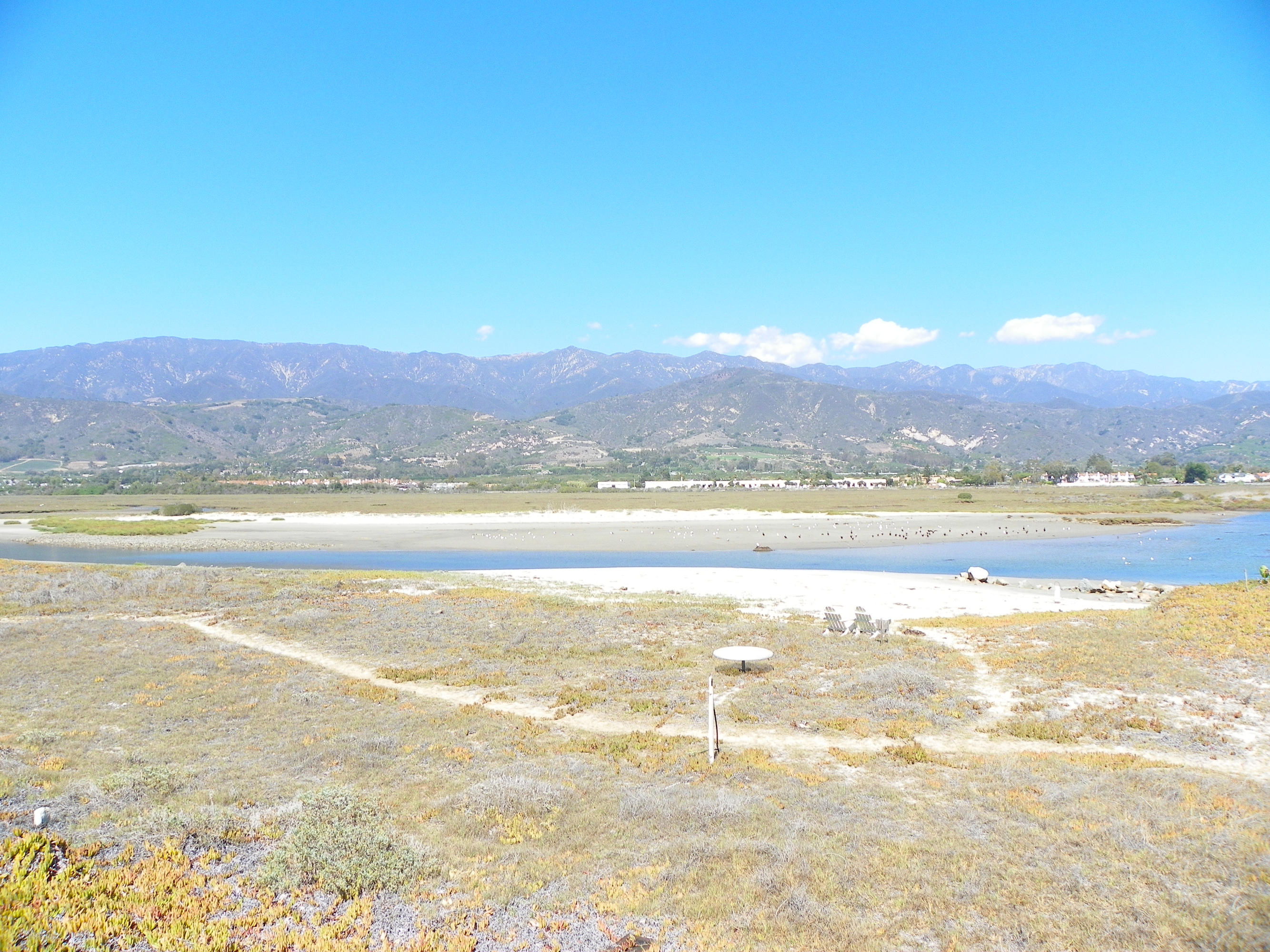 501 Sand Point Road Carpinteria, CA 93013 - Photo 18 of 19 a view of an ocean and a mountain