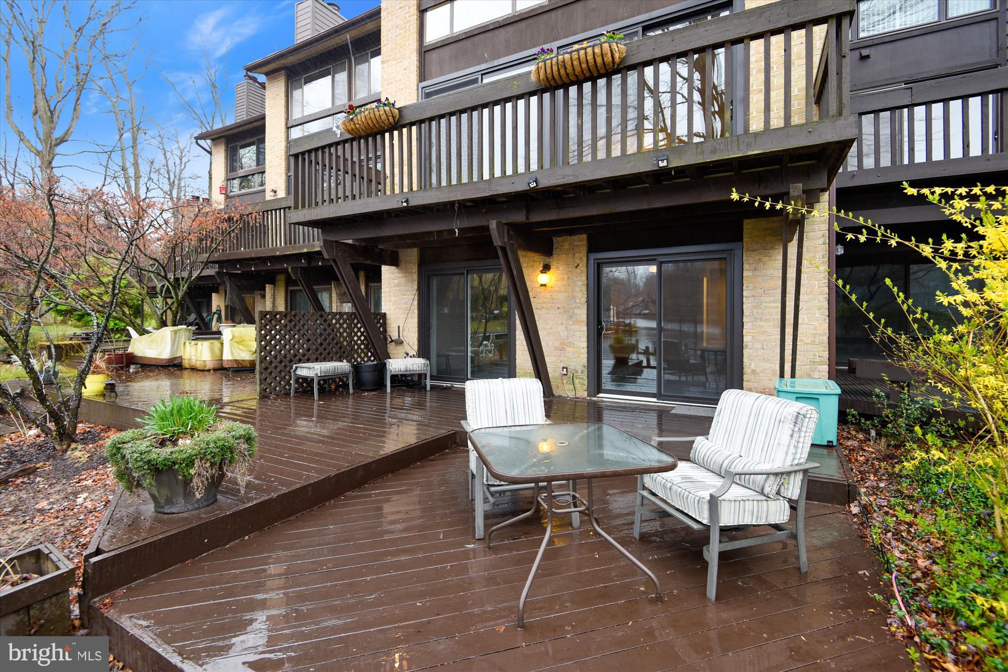 11328 Dockside Circle Reston, VA 20191 - Photo 34 of 44 Lakeside patio accessible from Family Room & BR#4