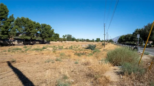 a view of a house with yard and sitting area