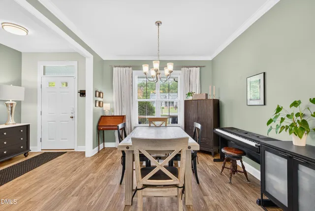 a dining room with furniture window wooden floor