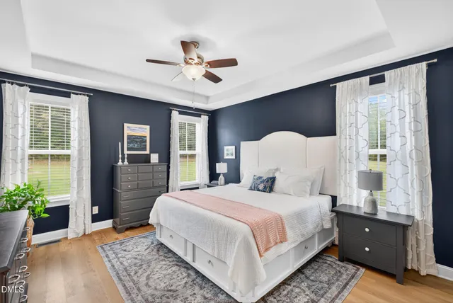 a bedroom with a large bed and a window