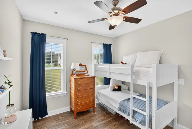 a room with a bed and a chandelier