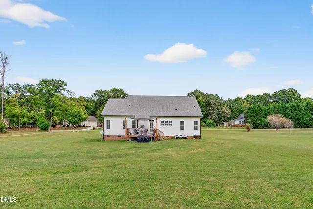 a aerial view of a house with table and chairs