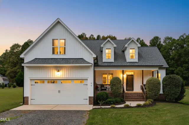 a view of an house with outdoor space and porch