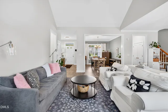 a living room with furniture and a rug