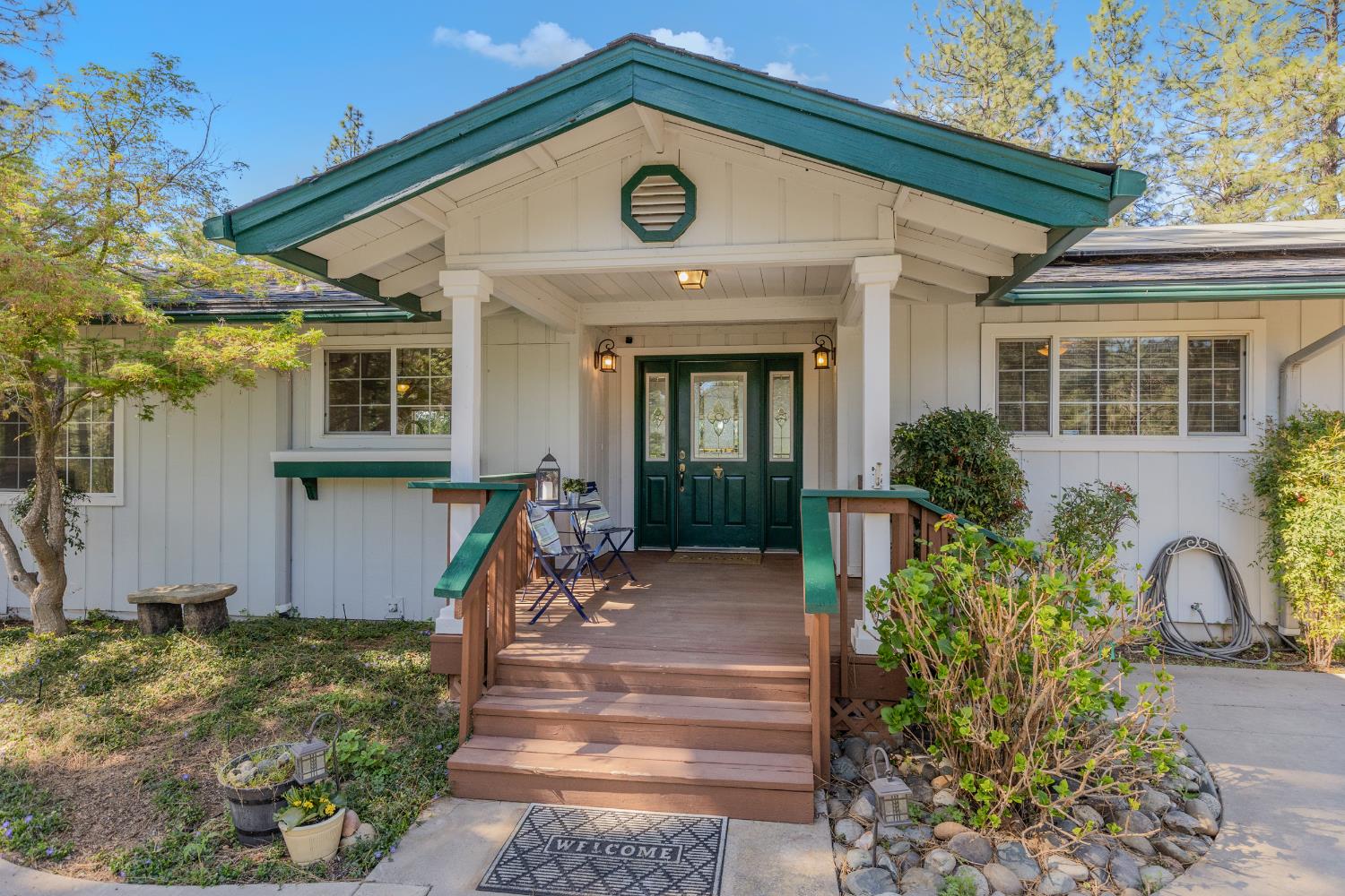 26375 Barb Wire Lane Colfax, CA 95713 - Photo 1 of 1 a front view of a house with garden