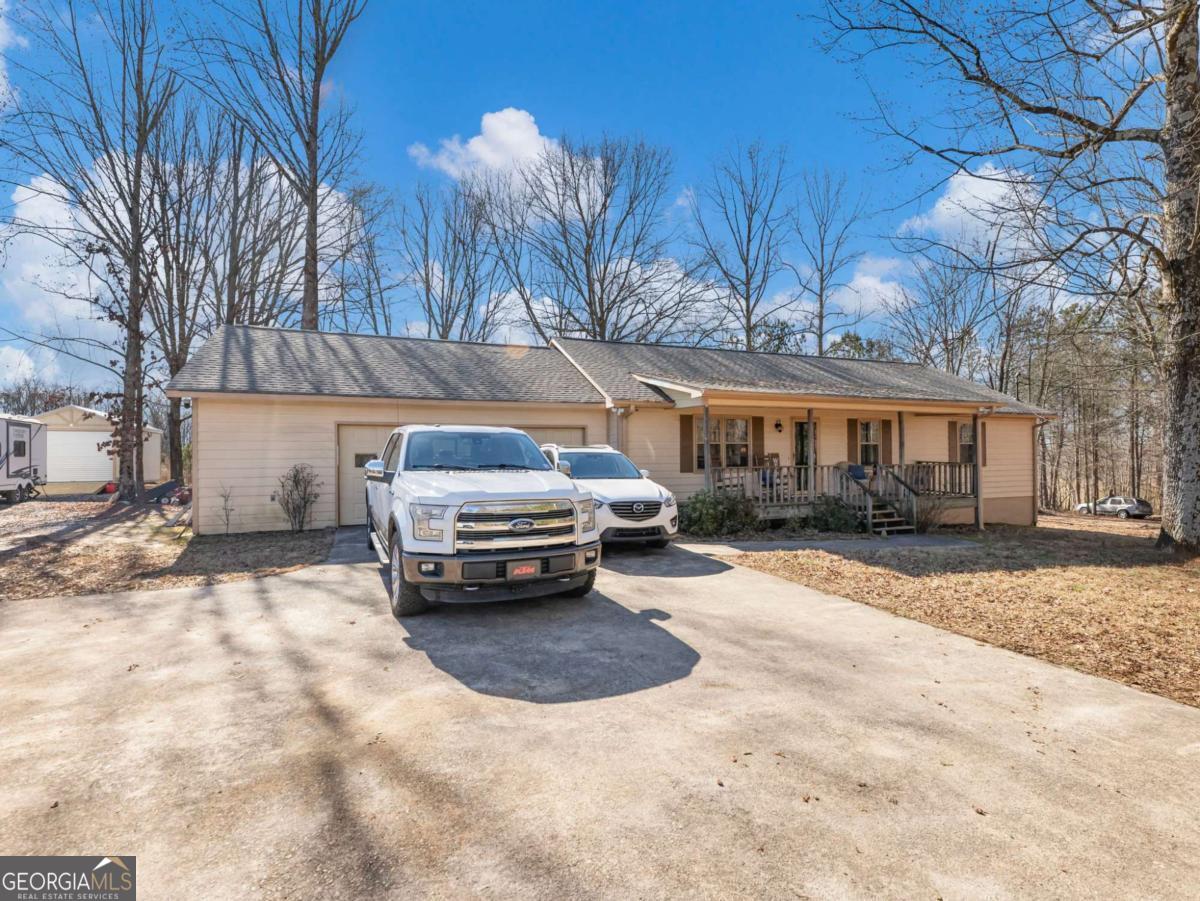 5539 McEver Road Flowery Branch, GA 30542 - Photo 1 of 41 a view of a car parked in front of a building