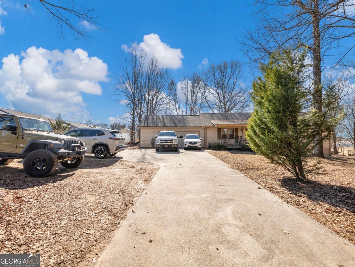 5539 McEver Road Flowery Branch, GA 30542 - Photo 2 of 41 a view of a car parked in front of a building