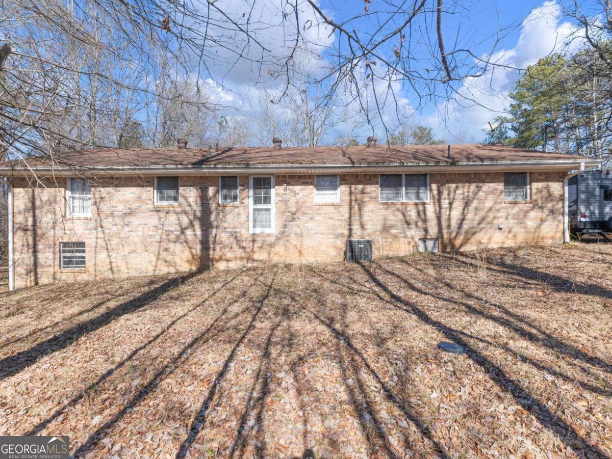 5539 McEver Road Flowery Branch, GA 30542 - Photo 27 of 41 a view of a backyard of a house