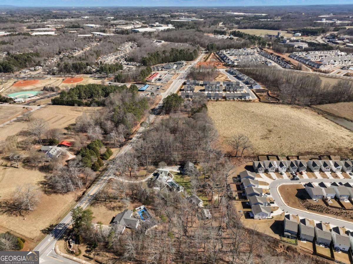 5539 McEver Road Flowery Branch, GA 30542 - Photo 31 of 41 an aerial view of a house with a mountain