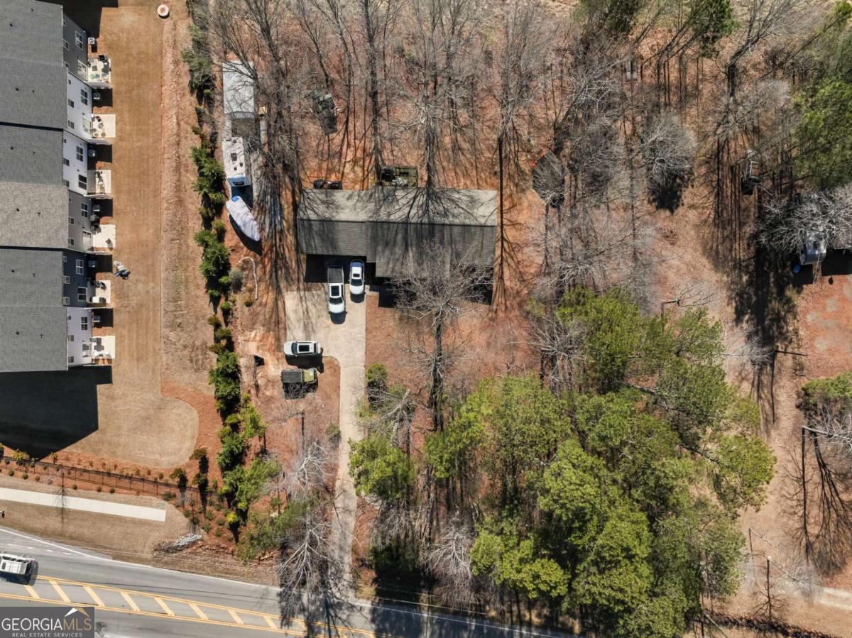 5539 McEver Road Flowery Branch, GA 30542 - Photo 38 of 41 an aerial view of residential house with outdoor space and trees