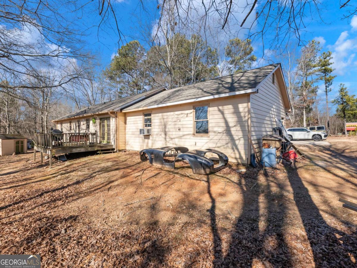 5539 McEver Road Flowery Branch, GA 30542 - Photo 5 of 41 a view of a backyard of the house