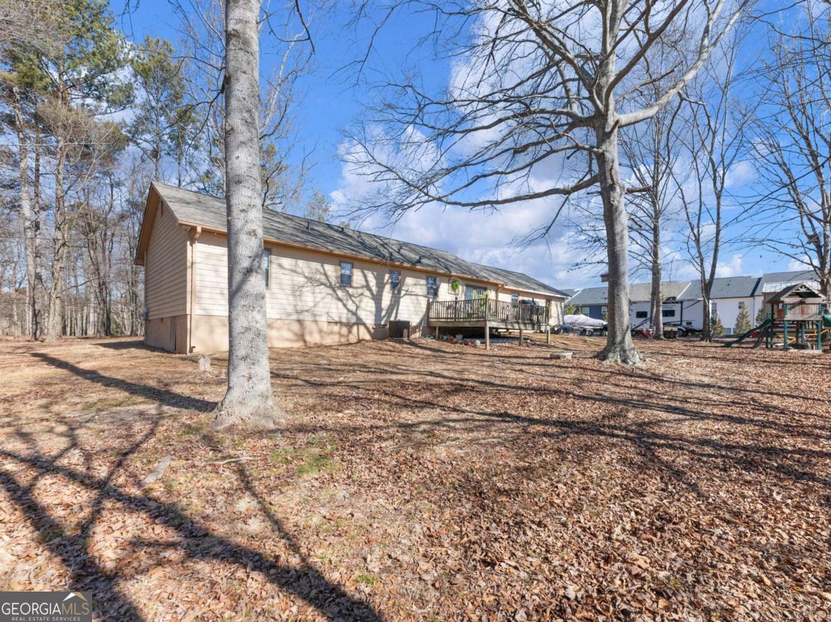 5539 McEver Road Flowery Branch, GA 30542 - Photo 8 of 41 a view of yard with tree