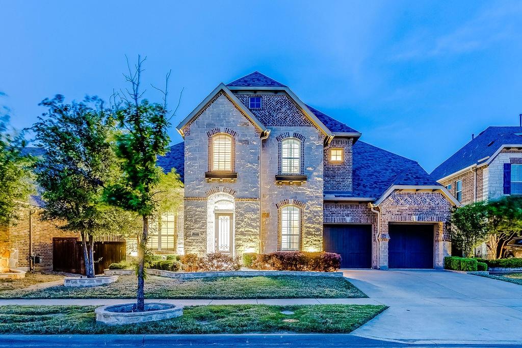 8126 Pitkin Road Frisco, TX 75036 - Photo 1 of 1 French provincial home featuring concrete driveway, a garage, stone siding, and brick siding