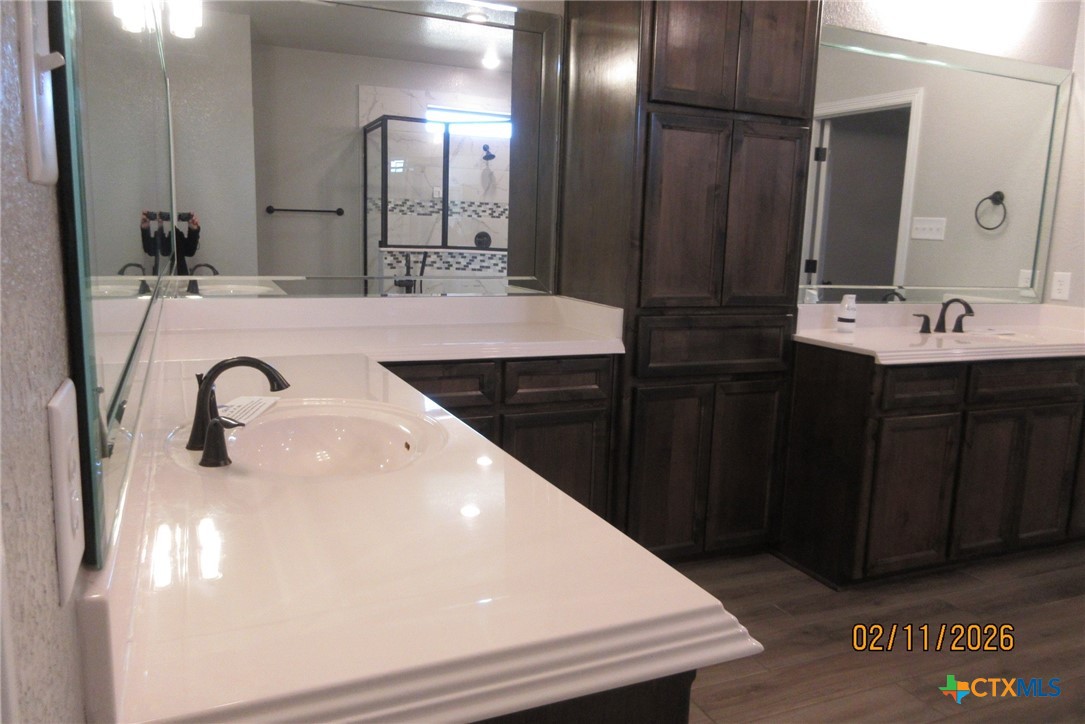 7623 Palladium Loop Killeen, TX 76542 - Photo 18 of 40 a bathroom with a double vanity sink and a mirror