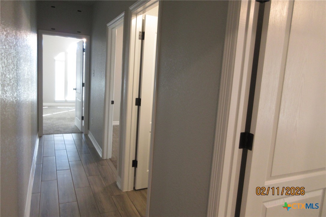 7623 Palladium Loop Killeen, TX 76542 - Photo 25 of 40 a view of a hallway with wooden floor
