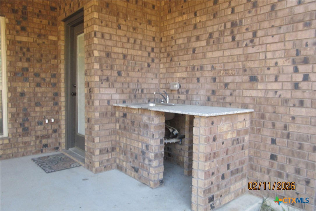 7623 Palladium Loop Killeen, TX 76542 - Photo 32 of 40 a bathroom with a shower and a sink