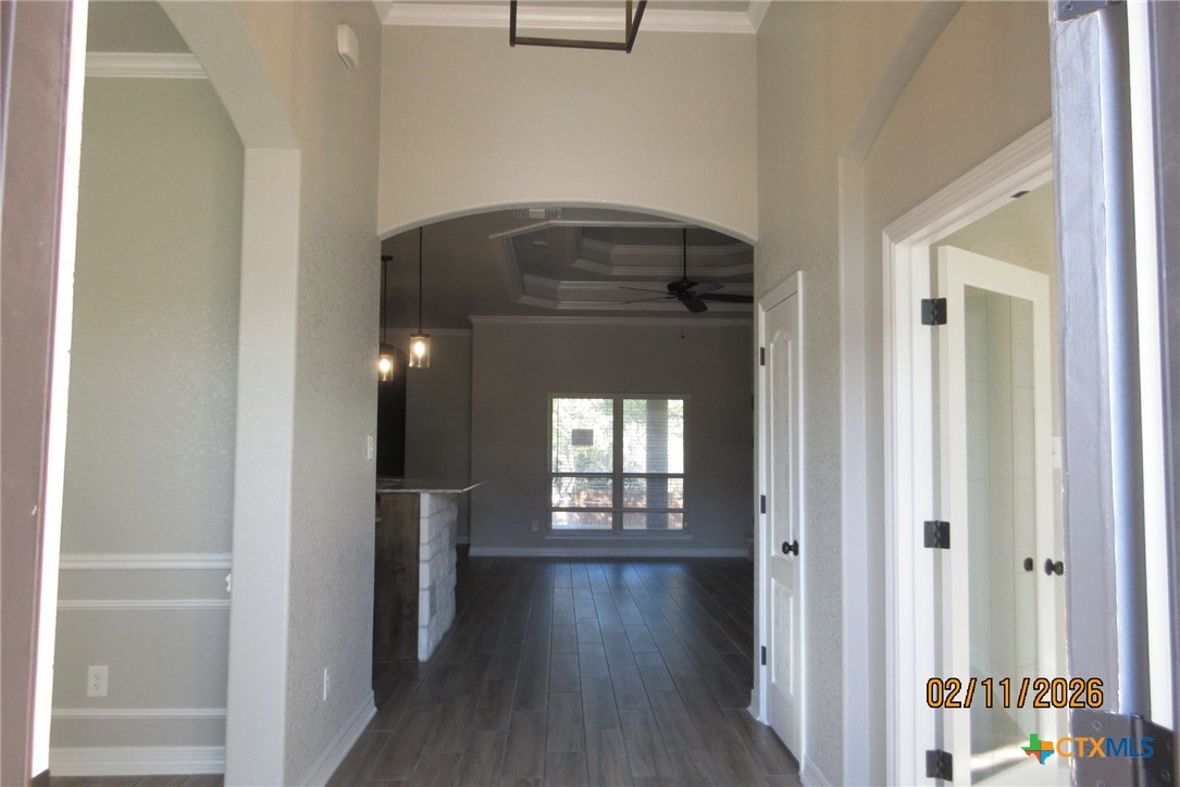 7623 Palladium Loop Killeen, TX 76542 - Photo 4 of 40 a view of a hallway with wooden floor and a living room