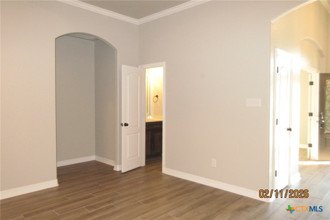 7623 Palladium Loop Killeen, TX 76542 - Photo 10 of 40 a view of an empty room with wooden floor