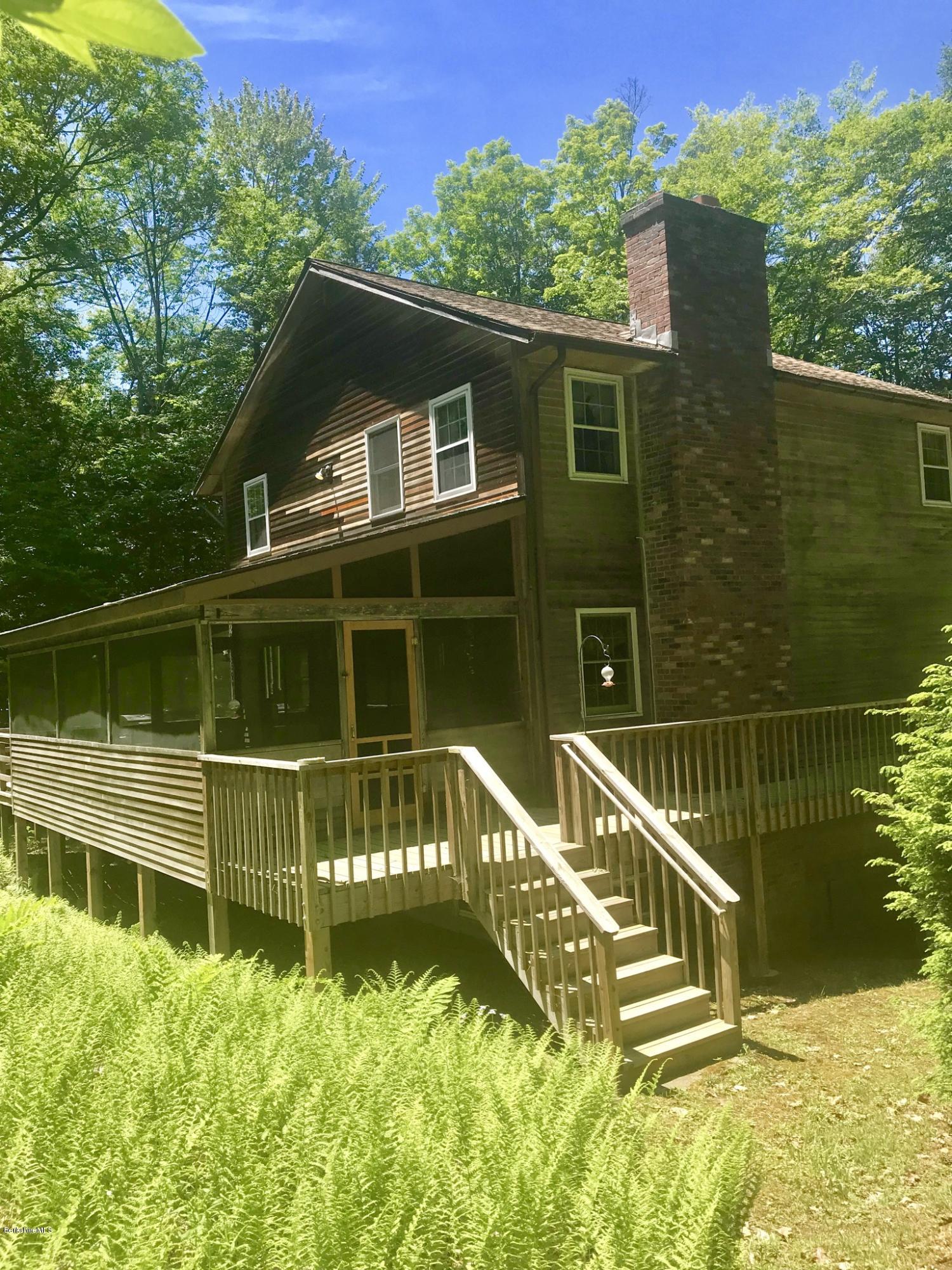 2401 West Center Road Otis, MA 01253 - Photo 1 of 24 a view of a house with a balcony