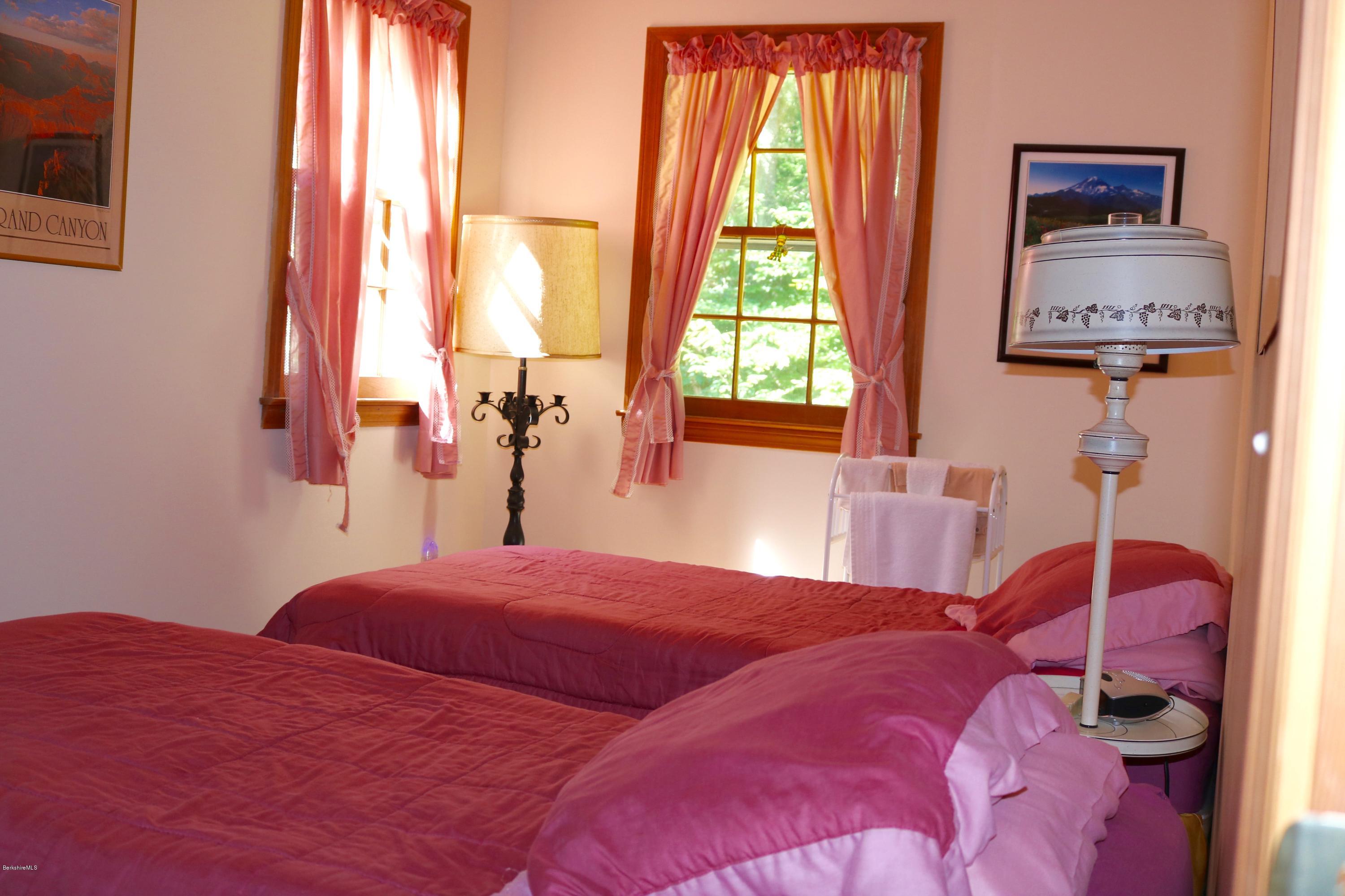 2401 West Center Road Otis, MA 01253 - Photo 13 of 24 a bedroom with a bed and a large window