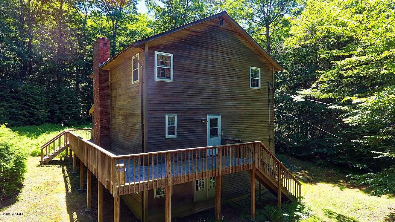 2401 West Center Road Otis, MA 01253 - Photo 17 of 24 a backyard of a house with seating space