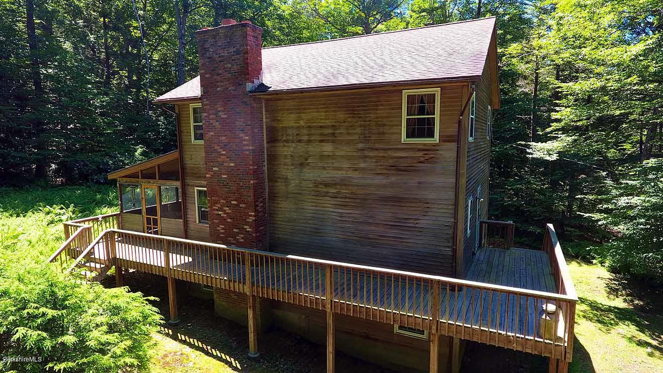 2401 West Center Road Otis, MA 01253 - Photo 18 of 24 a view of a house with a balcony