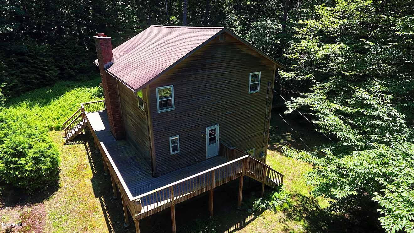 2401 West Center Road Otis, MA 01253 - Photo 21 of 24 a backyard of a house with lots of green space