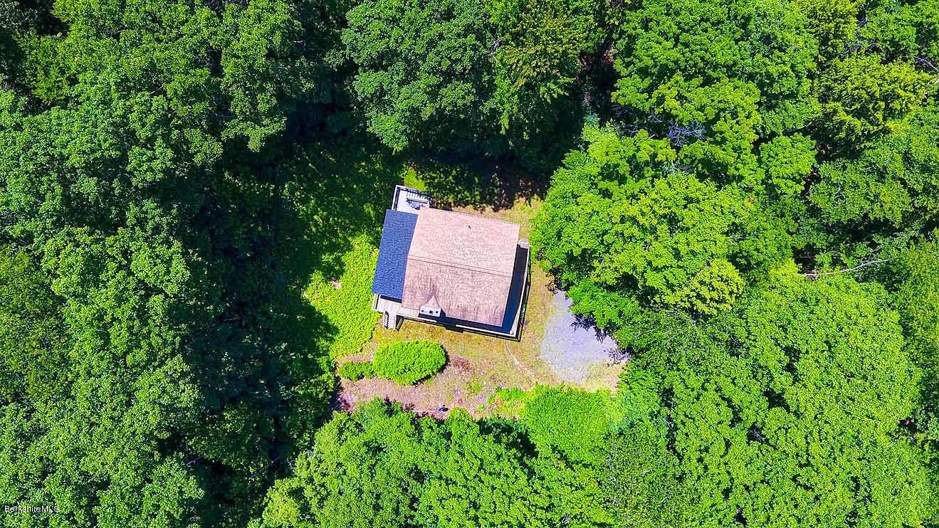 2401 West Center Road Otis, MA 01253 - Photo 23 of 24 an aerial view of a house with a yard and swimming pool