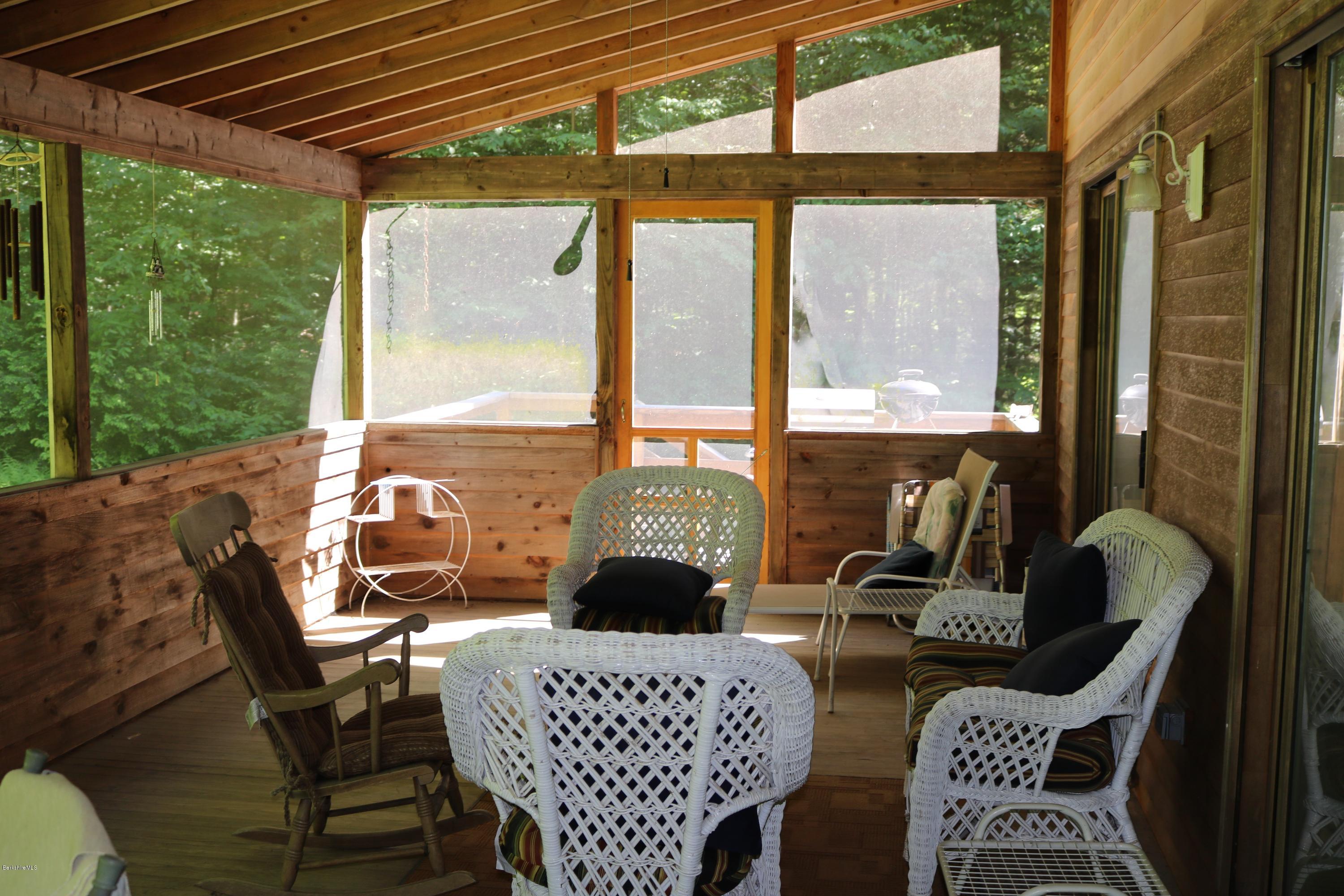 2401 West Center Road Otis, MA 01253 - Photo 8 of 24 a living room with furniture a large window