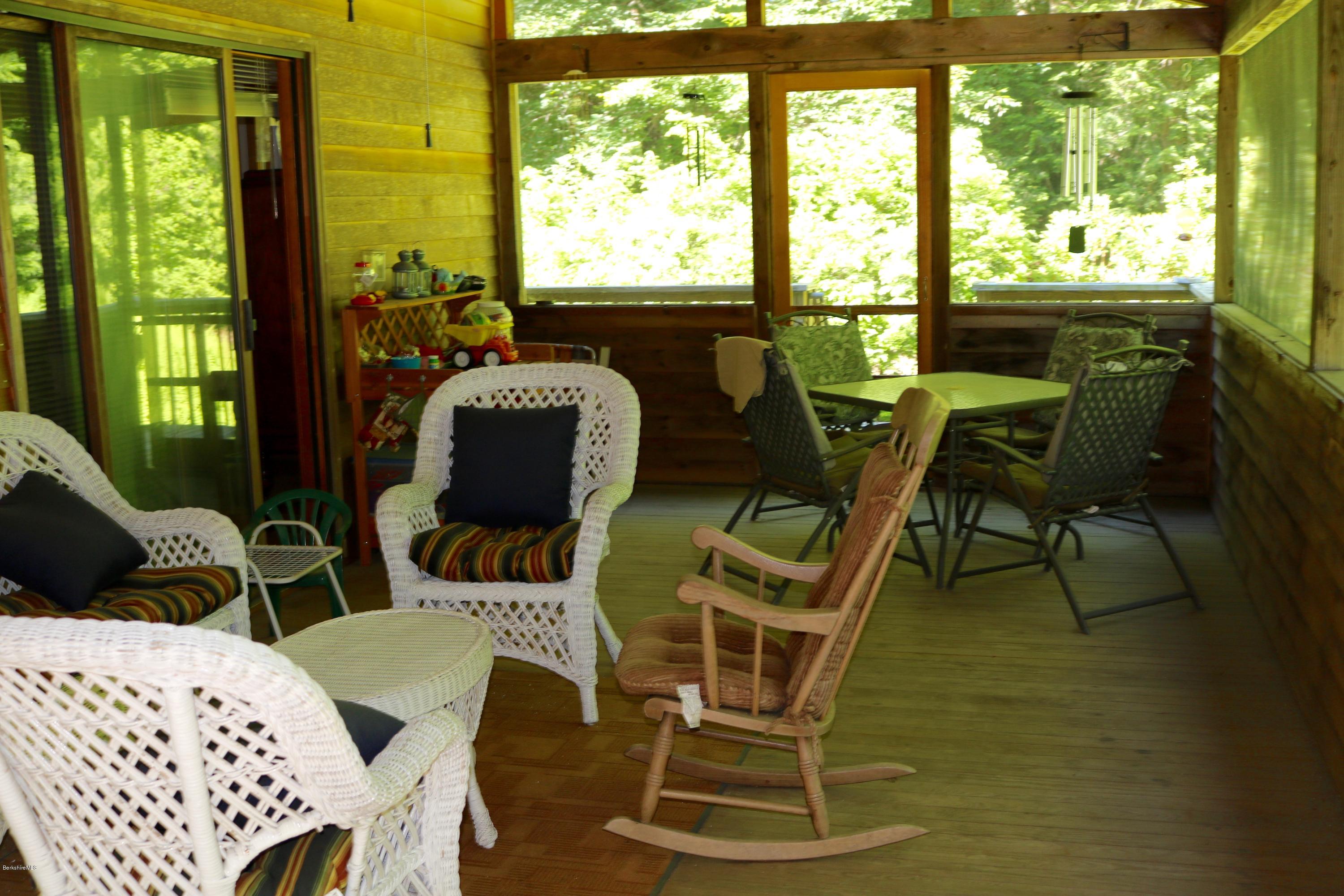 2401 West Center Road Otis, MA 01253 - Photo 9 of 24 a view of a dining room with furniture window and outside view