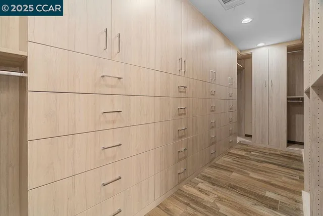 a spacious bathroom with a granite countertop sink mirror and shower
