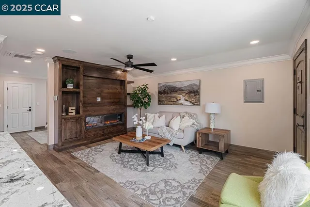 a view of a backyard with couches plants and lake view