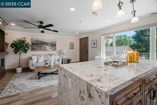 a view of a patio with couches and a fire pit