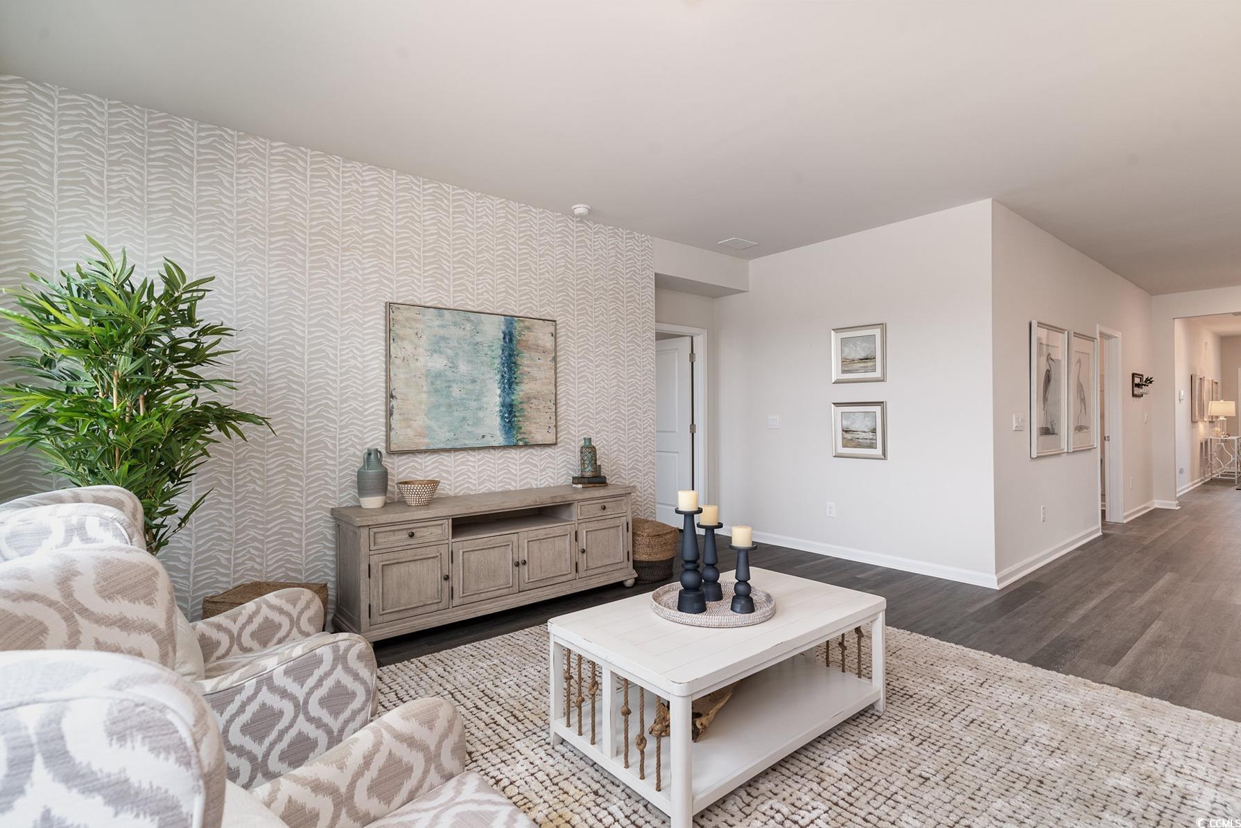 7367 Meadow Walk Loop Loris, SC 29569 - Photo 10 of 25 Living room featuring baseboards, wood finished floors, and wallpapered walls