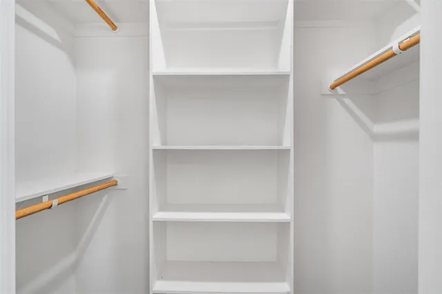 a view of an empty walk in closet