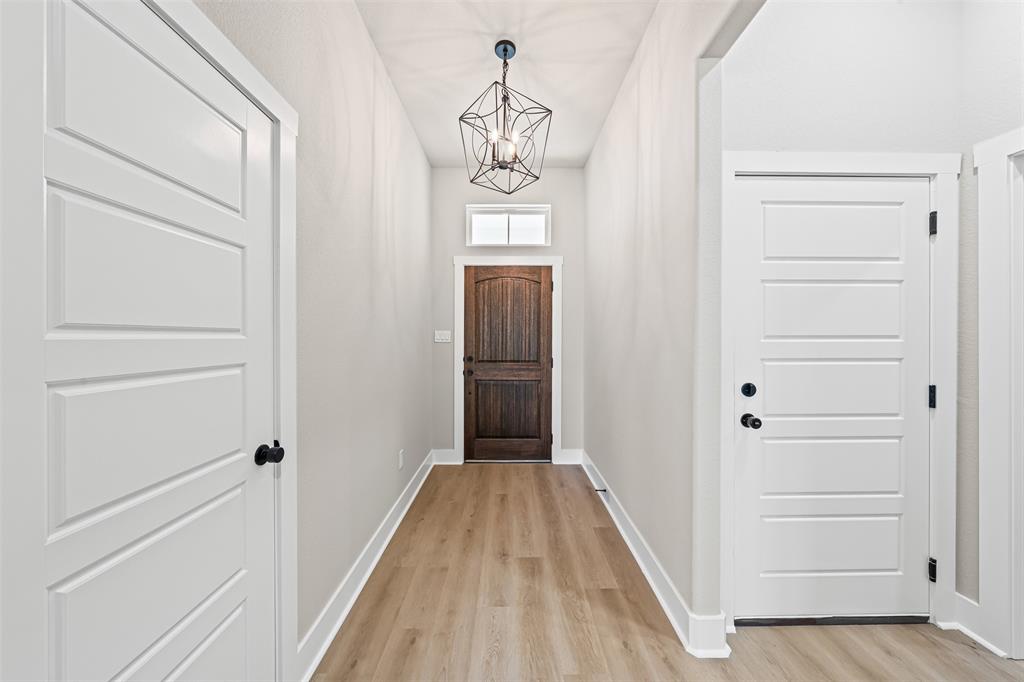 825 Forward Pass Drive Hewitt, TX 76643 - Photo 18 of 37 a view of a hallway view with wooden floor and staircase