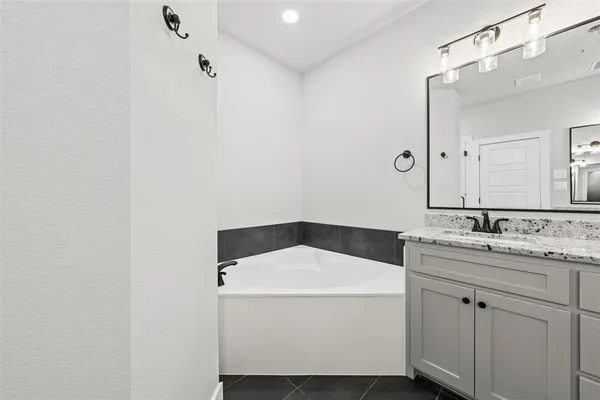 a utility room with a sink dryer and washer