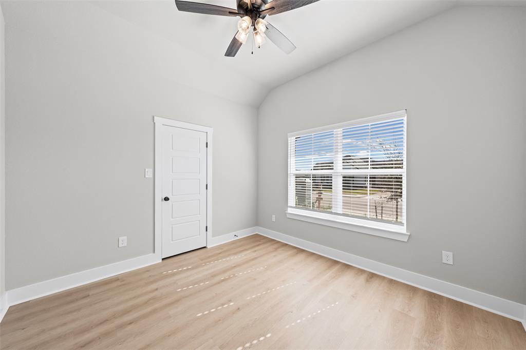 825 Forward Pass Drive Hewitt, TX 76643 - Photo 6 of 37 an empty room with a window and ceiling fan