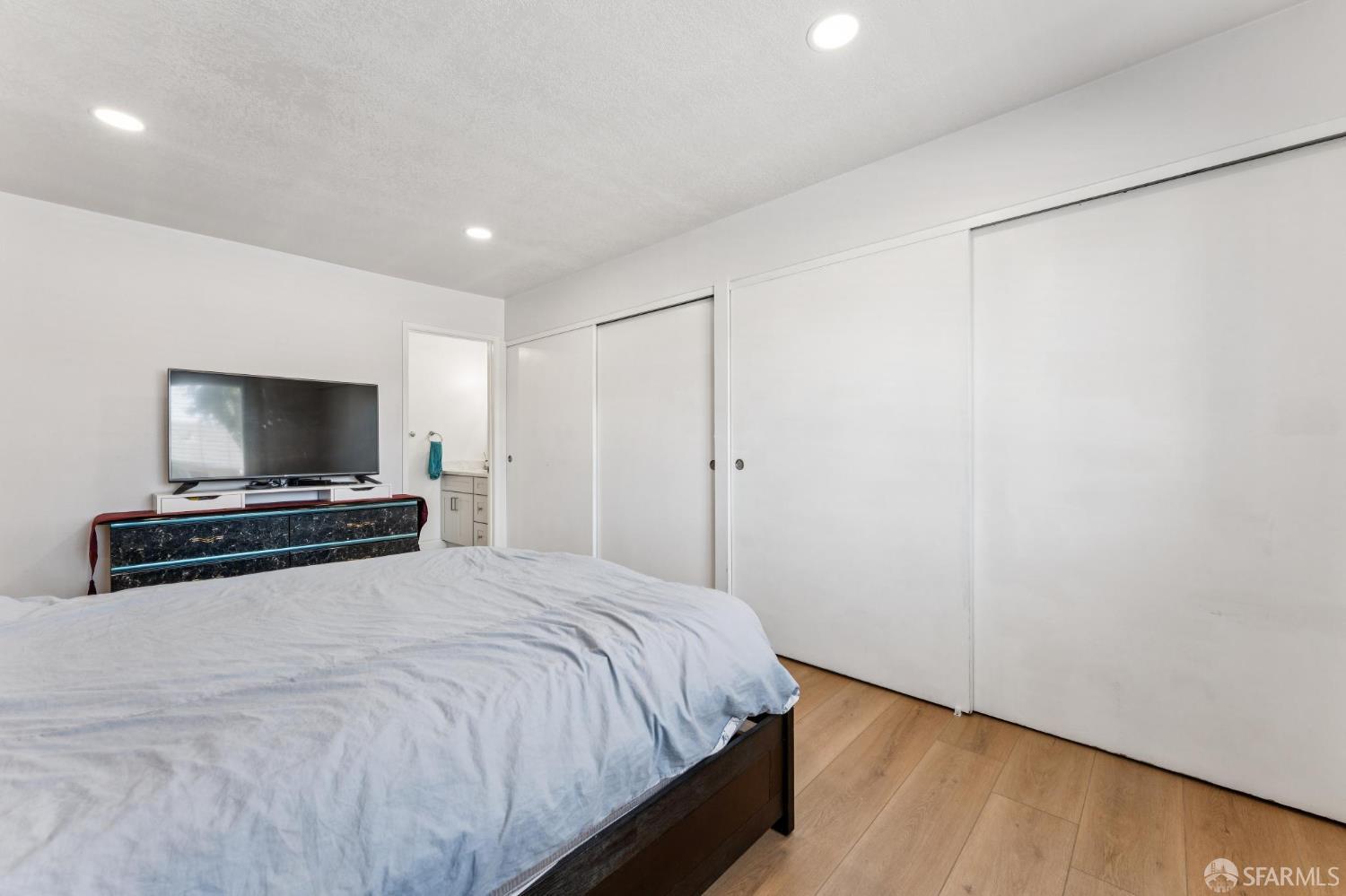 27788 Hummingbird Court Hayward, CA 94545 - Photo 15 of 36 a bedroom with a bed and a flat screen tv