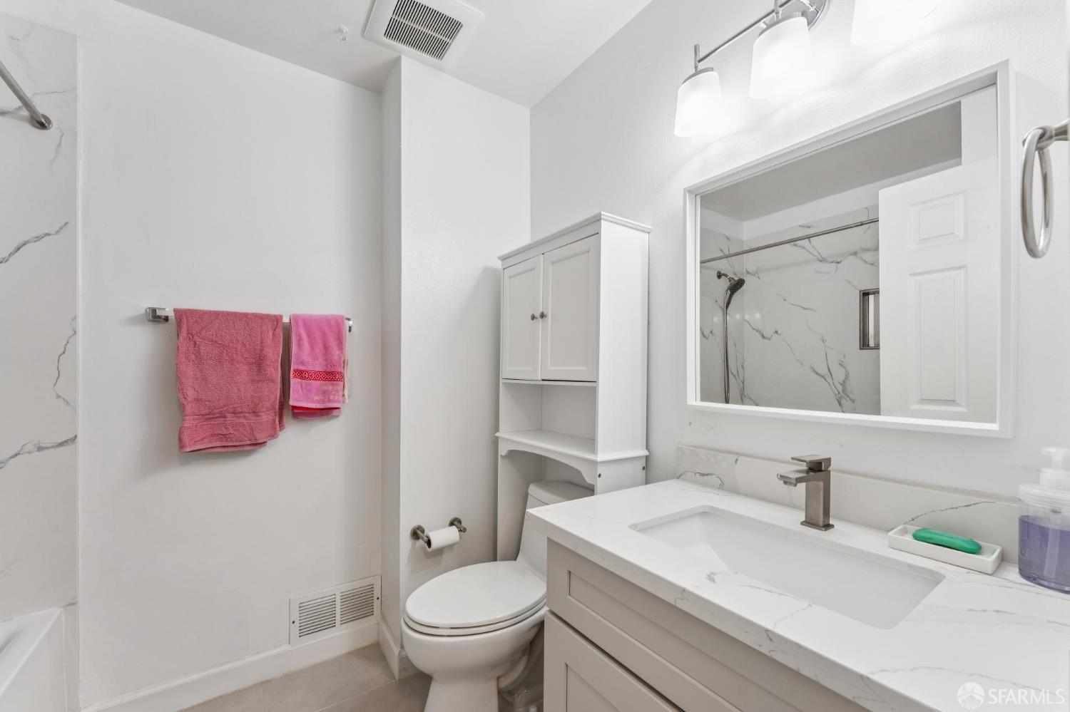 27788 Hummingbird Court Hayward, CA 94545 - Photo 21 of 36 a bathroom with a sink toilet and vanity