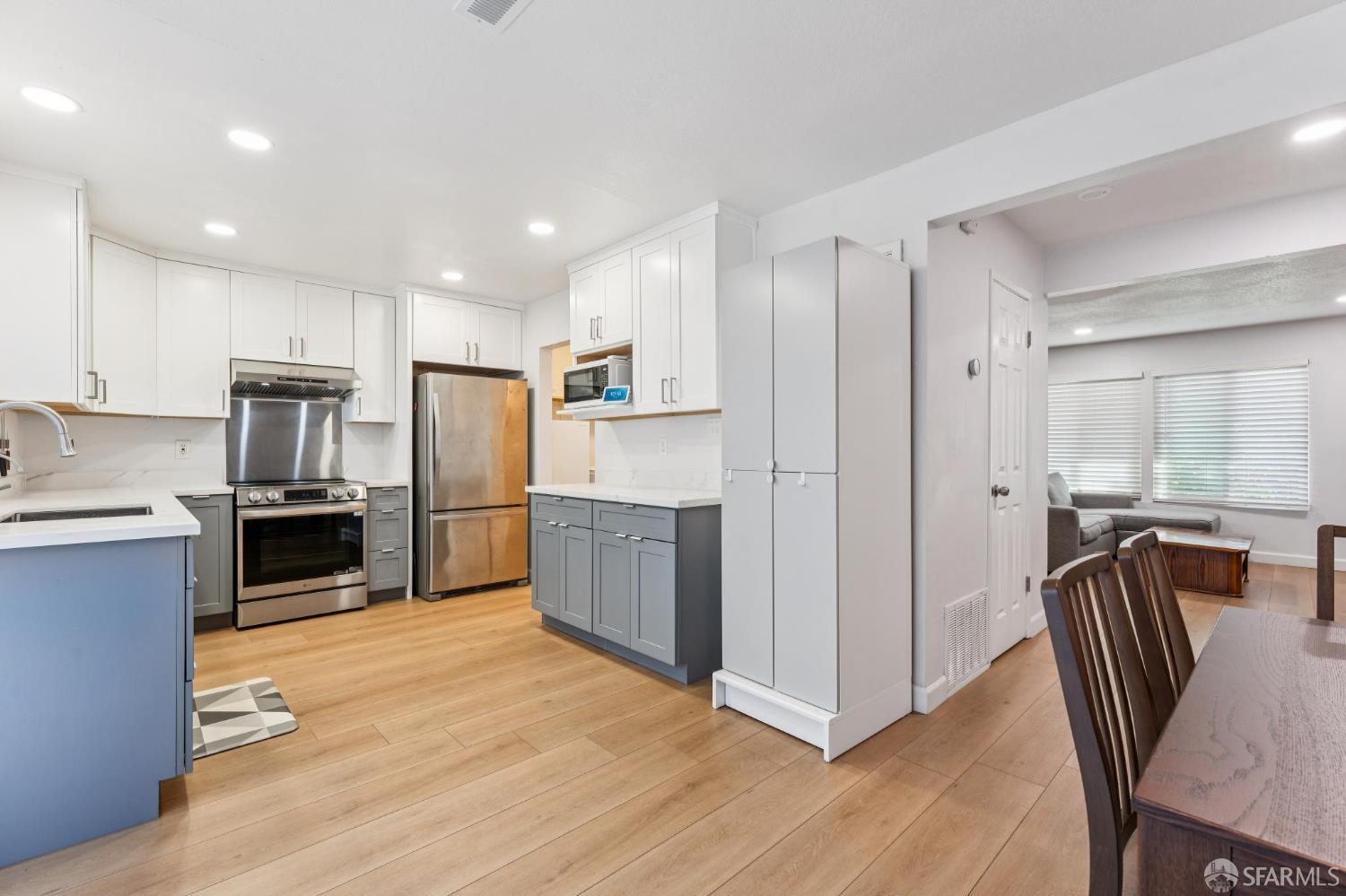 27788 Hummingbird Court Hayward, CA 94545 - Photo 6 of 36 a kitchen with kitchen island a counter top space stainless steel appliances and cabinets