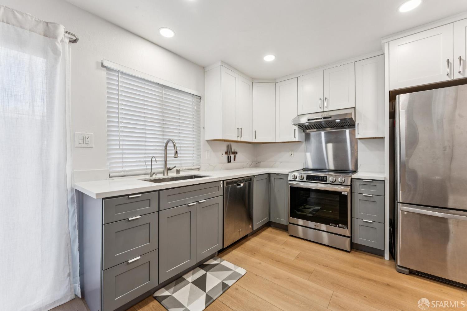 27788 Hummingbird Court Hayward, CA 94545 - Photo 8 of 36 a kitchen with a sink stainless steel appliances and cabinets